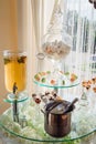 Lemonade in glass bar, macaroons and marshmallows stand served