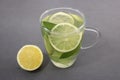 Lemonade in a Glass Cup with Lemon Slices and Mint Leaves Royalty Free Stock Photo