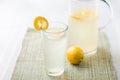 Lemonade glass and pitcher. Royalty Free Stock Photo