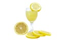 Lemonade in glass and sliced pieces lemons on white background. Royalty Free Stock Photo