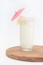 Lemonade in a glass with an umbrella and lemon Royalty Free Stock Photo