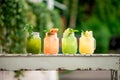 Lemonade grape kiwi pineaple lime and banana on terrace summer spring table cafe restaurant bokeh