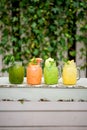 Lemonade grape kiwi pineaple lime and banana on terrace summer spring table cafe restaurant bokeh