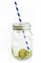 Lemonade with ice, lemon and lime slices in a jar with straw Royalty Free Stock Photo