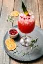 Lemonade or juice. Alcohol drink or cocktail. Images for bar or restaurant menu. Red drink with ice lemon and berries Royalty Free Stock Photo