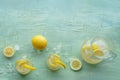 Lemonade. Lemon water drink with ice. Two glasses and a pitcher on blue Royalty Free Stock Photo