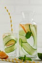 Lemonade made from cucumber, lemon and mint in a glass bottle and glass Royalty Free Stock Photo