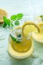 Lemonade with mint. Lemon water drink with ice. Two glasses and lemons Royalty Free Stock Photo