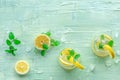 Lemonade with mint. Lemon water drink with ice. Two glasses and lemons Royalty Free Stock Photo