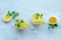 Lemonade with mint. Lemon water drink with ice. Two glasses and lemons Royalty Free Stock Photo