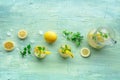 Lemonade with mint. Lemon water drink with ice. Two glasses and a pitcher Royalty Free Stock Photo
