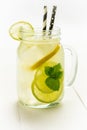 Lemonade Mojito Cocktail with Cold Fresh Ice, Lemon and Mint Leaves in Mason Jar Royalty Free Stock Photo