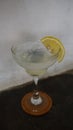 Lemonade. refreshing sparkling drink in an elegant glass garnished with a lemon wedge Royalty Free Stock Photo