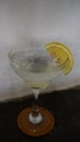 Lemonade. refreshing sparkling drink in an elegant glass garnished with a lemon wedge Royalty Free Stock Photo