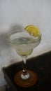 Lemonade. refreshing sparkling drink in an elegant glass garnished with a lemon wedge Royalty Free Stock Photo