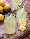 Lemonade with sliced lemons, ice and rosemary Royalty Free Stock Photo