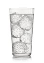 Lemonade sparkling mineral water with ice cubes and bubbles on white background Royalty Free Stock Photo