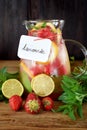 Lemonade with strawberry, lemon, mint, lime and ice cubes Royalty Free Stock Photo