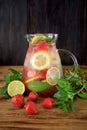 Lemonade with strawberry, lemon, mint, lime and ice cubes Royalty Free Stock Photo