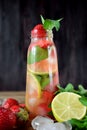 Lemonade with strawberry, lime, ice cubes and mint Royalty Free Stock Photo