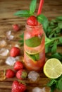 Lemonade with strawberry, lime, ice cubes and mint Royalty Free Stock Photo