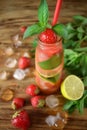 Lemonade with strawberry, lime, ice cubes and mint Royalty Free Stock Photo