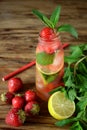 Lemonade with strawberry, lime, ice cubes and mint Royalty Free Stock Photo