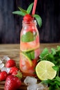 Lemonade with strawberry, lime, ice cubes and mint Royalty Free Stock Photo