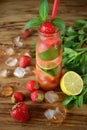 Lemonade with strawberry, lime, ice cubes and mint Royalty Free Stock Photo