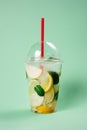 Lemonade to go cup on lightgreen background, isolated