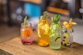 Lemonades. Lemonades with fresh tropical fruit and cucumber on b