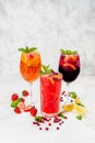 Lemonades from orange, strawberries in one frame Royalty Free Stock Photo