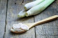 Lemongrass slice in wooden spoon on wooden table