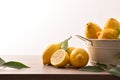 Lemons basket on wooden kitchen bench front Royalty Free Stock Photo