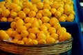 Lemons in the baskets on display at farmer`s market Royalty Free Stock Photo