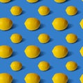 Lemons on blue background, flat lay, top view, pattern. Royalty Free Stock Photo