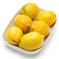 Lemons in a dish isolated on white background Royalty Free Stock Photo