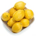 Lemons in a dish isolated on white background Royalty Free Stock Photo
