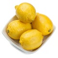 Lemons in a dish isolated on white background Royalty Free Stock Photo