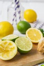 Lemons, limes, mint cocktail preparation on a wooden background Royalty Free Stock Photo