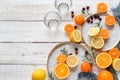 Lemons, mandarins and oranges on a white wooden table. Preparing to make some fresh juice Royalty Free Stock Photo