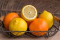 Lemons and oranges arranged in wicker basket Royalty Free Stock Photo