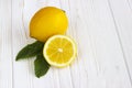 Lemons on white wooden table.