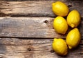 Lemons on wooden background