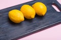 Lemons on a wooden board. citrus on a cutting board. Healthy food. Vitamins.