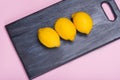 Lemons on a wooden board. citrus on a cutting board. Healthy food. Vitamins.