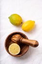 Lemons with wooden Juicer Royalty Free Stock Photo