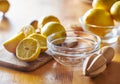 Lemons with wooden reamer ready to be juiced and squeezed Royalty Free Stock Photo