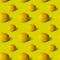 Lemons on yellow background, flat lay, top view, pattern. Royalty Free Stock Photo