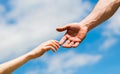 Lending a helping hand. Solidarity, compassion, and charity, rescue. Hands of man and woman reaching to each other Royalty Free Stock Photo